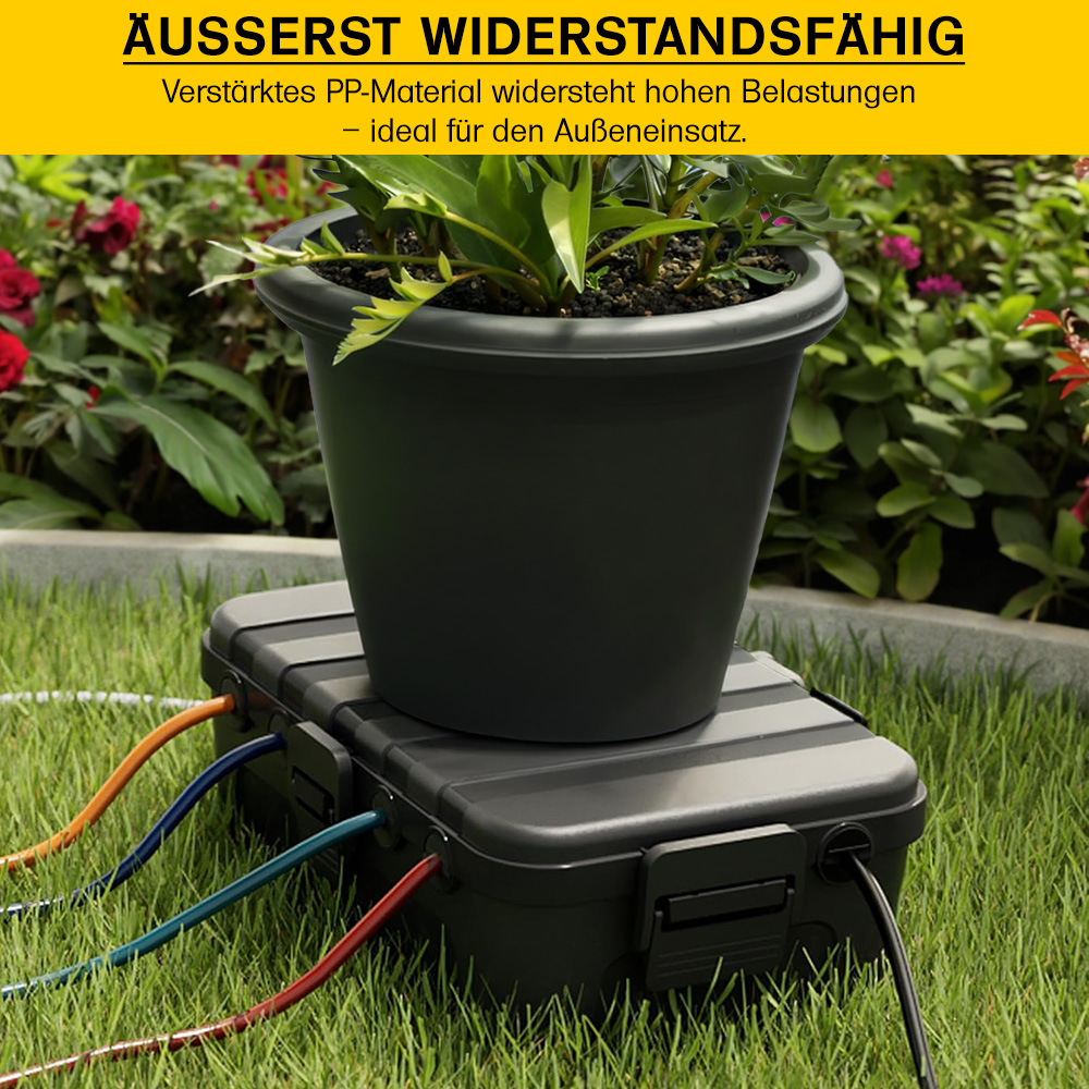Blumentopf auf widerstandsfähiger Kabelbox stehend