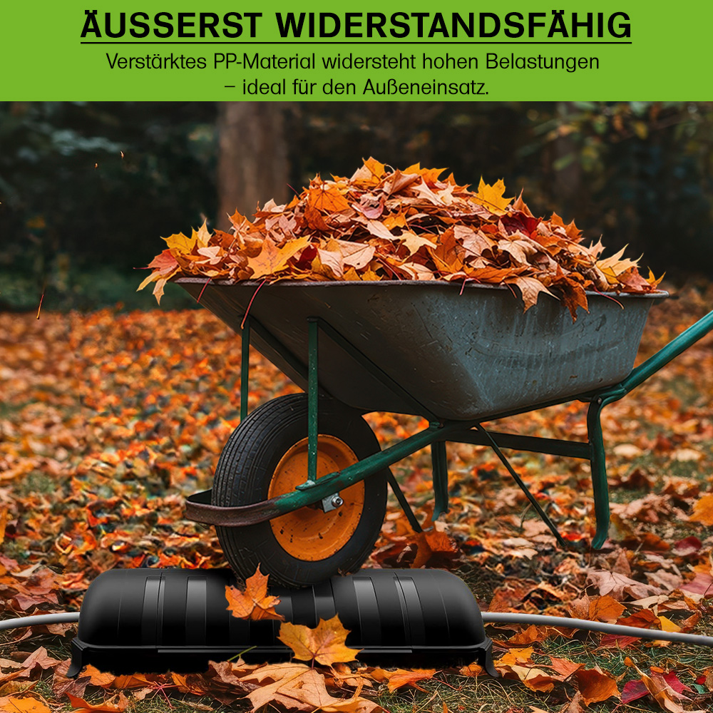 Schubkarre die über widerstandsfähige Kabelbox fährt
